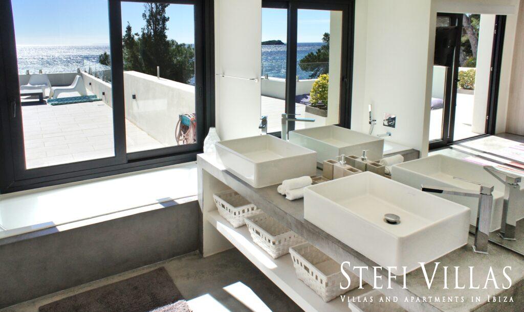 Modern villa with pool on the seafront in Ibiza