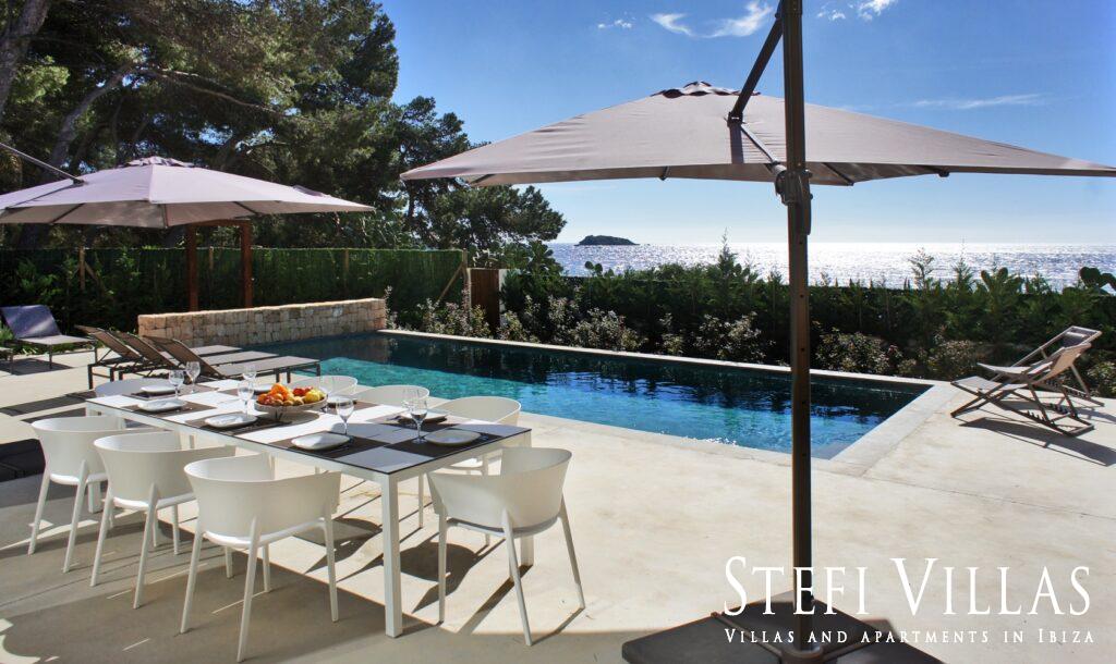 Modern villa with pool on the seafront in Ibiza