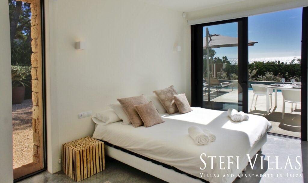 Modern villa with pool on the seafront in Ibiza