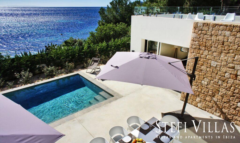 Modern villa with pool on the seafront in Ibiza